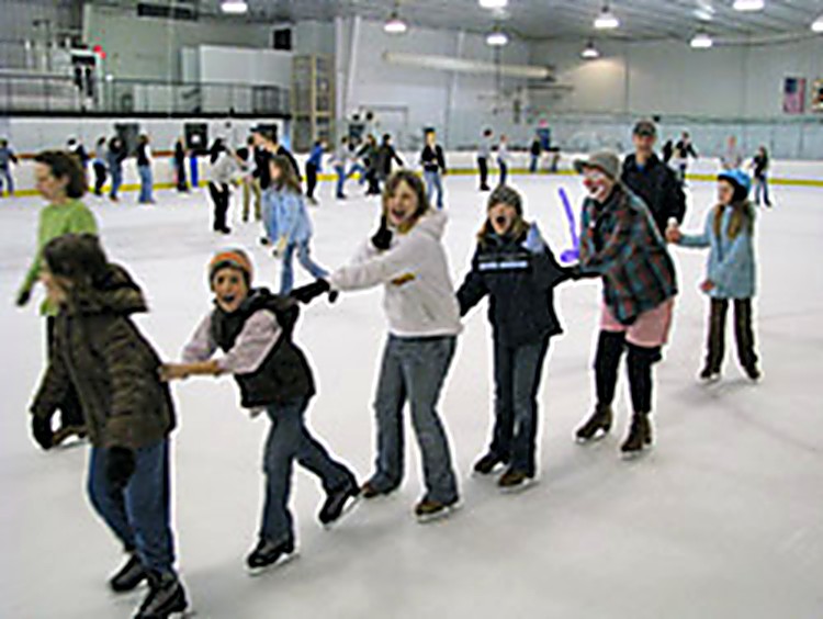 Families skating together at the Family Skate for Abby event